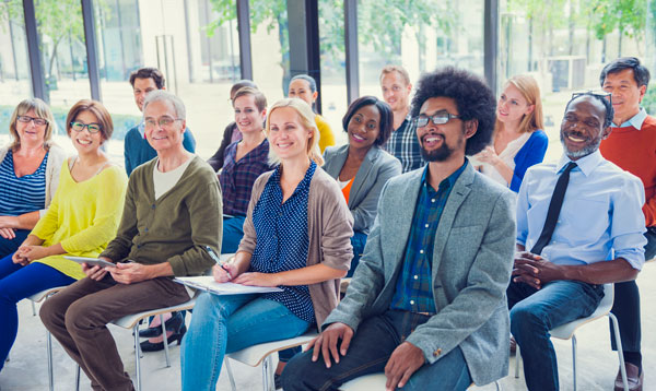 A group of faculty recieving a presentation.
