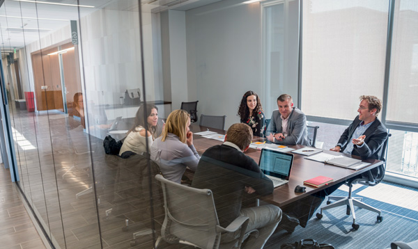 A group of people in a conference room.